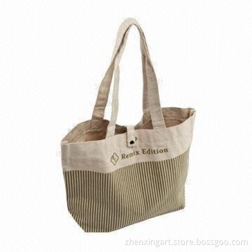 Canvas shopping bag with button closure and eco-friendly material